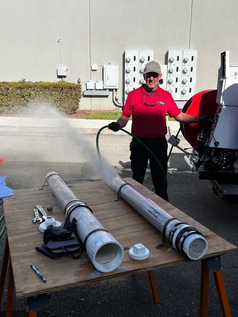 Hydro jetting demonstration for sewer line cleaning in Cape Coral FL using high-pressure water jet equipment